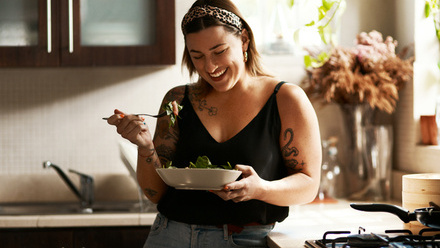 Woman eating salad