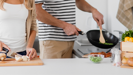 couple cooking at home.png