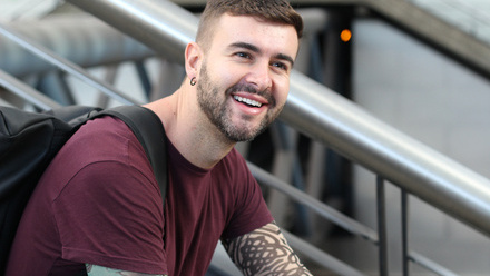 Tattooed_man_smiling.jpg