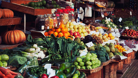 In Britain we're lucky enough to grow some fantastic fruit and vegetables. This image shows a greengrocers' fruit and veg stall with seasonal produce.